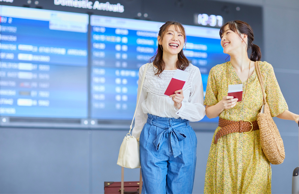 Biarritz airport terminal two young people with their boarding passport towards the beach love room